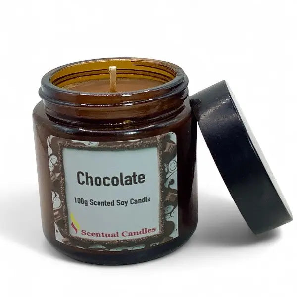 Scented soy candle in an amber jar labeled 'Chocolate' by Scentual Candles on a white background.