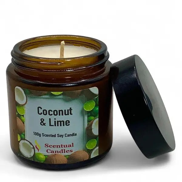 Coconut & Lime scented candle in an amber jar with a black lid on a white background
