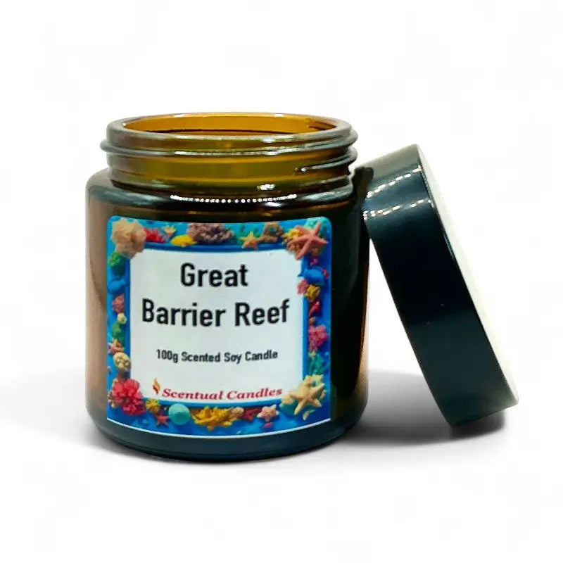 Tropical Scented Candle Great Barrier Reef in glass jar with vibrant label, open lid, surrounded by floral designs.