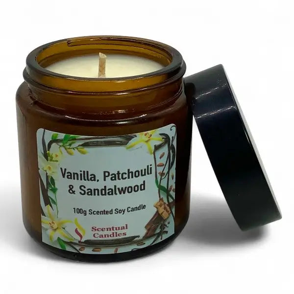 Amber glass candle with vanilla, patchouli, and sandalwood fragrance on a white background