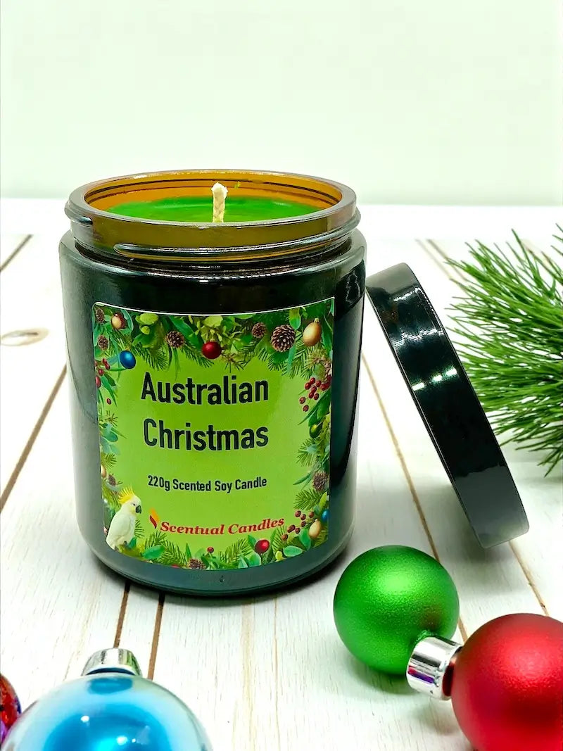 Australian Christmas scented soy candle in festive jar, surrounded by holiday decorations.