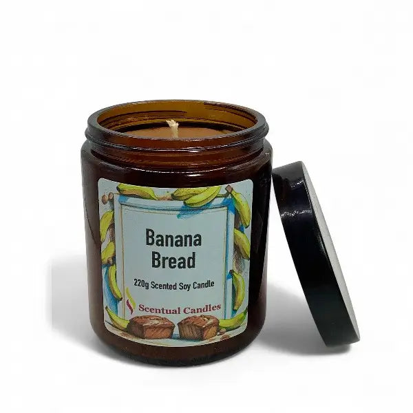 Banana bread scented candle in an amber jar with a label on a white background