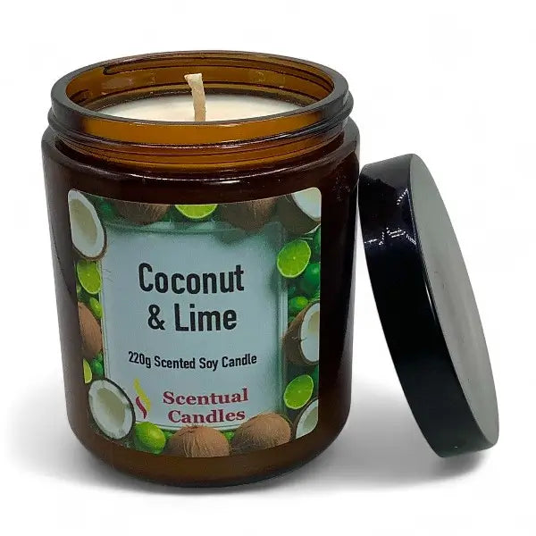 Coconut & Lime scented candle in an amber jar with a black lid on a white background