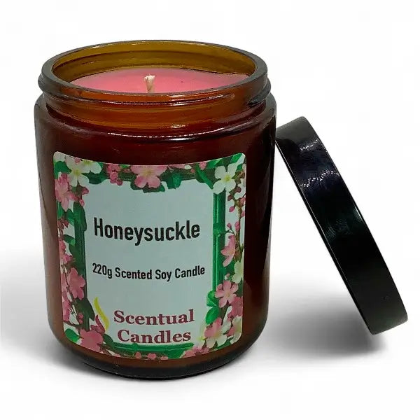 Honeysuckle scented candle in a brown jar with floral label on a white background