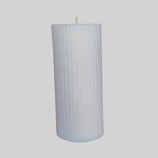 Vanilla Patchouli and Sandalwood white pillar candle made from premium soy wax for calming ambiance.