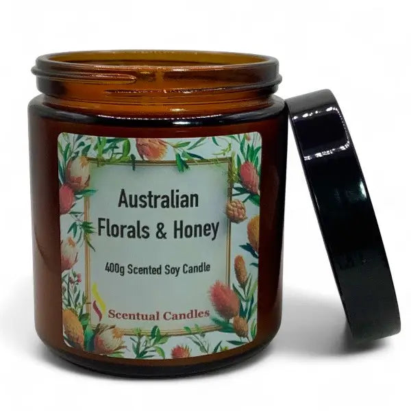 Scented candle jar labeled 'Australian Florals & Honey' by Scentual Candles on a white background.