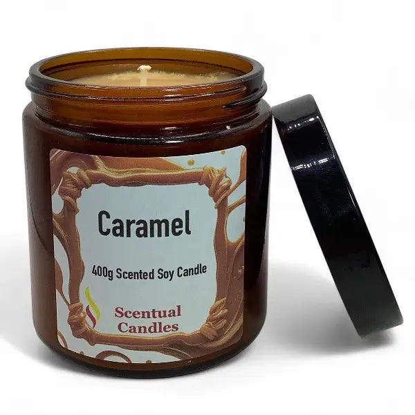 Caramel scented candle in a brown jar with a label on a white background