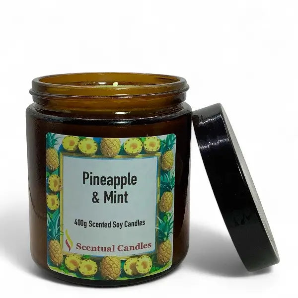 Scentual Candles pineapple & mint scented candle with label and lid on a white background
