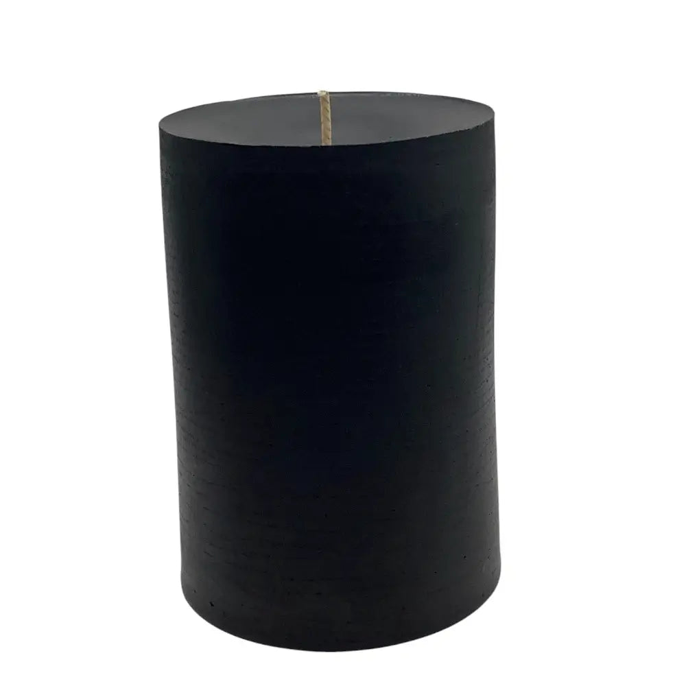 cylindrical black candle on a white background