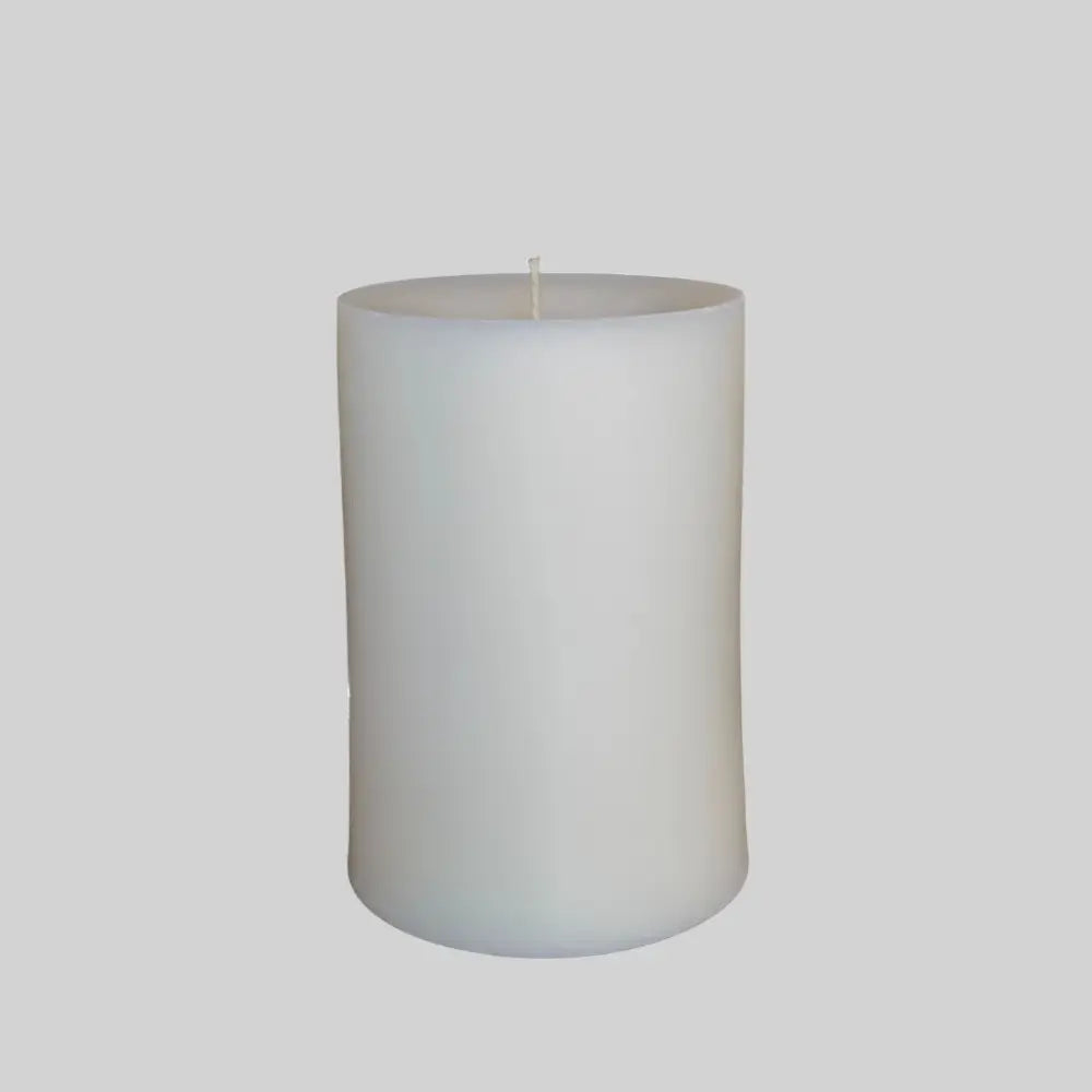 White candle on a light gray background