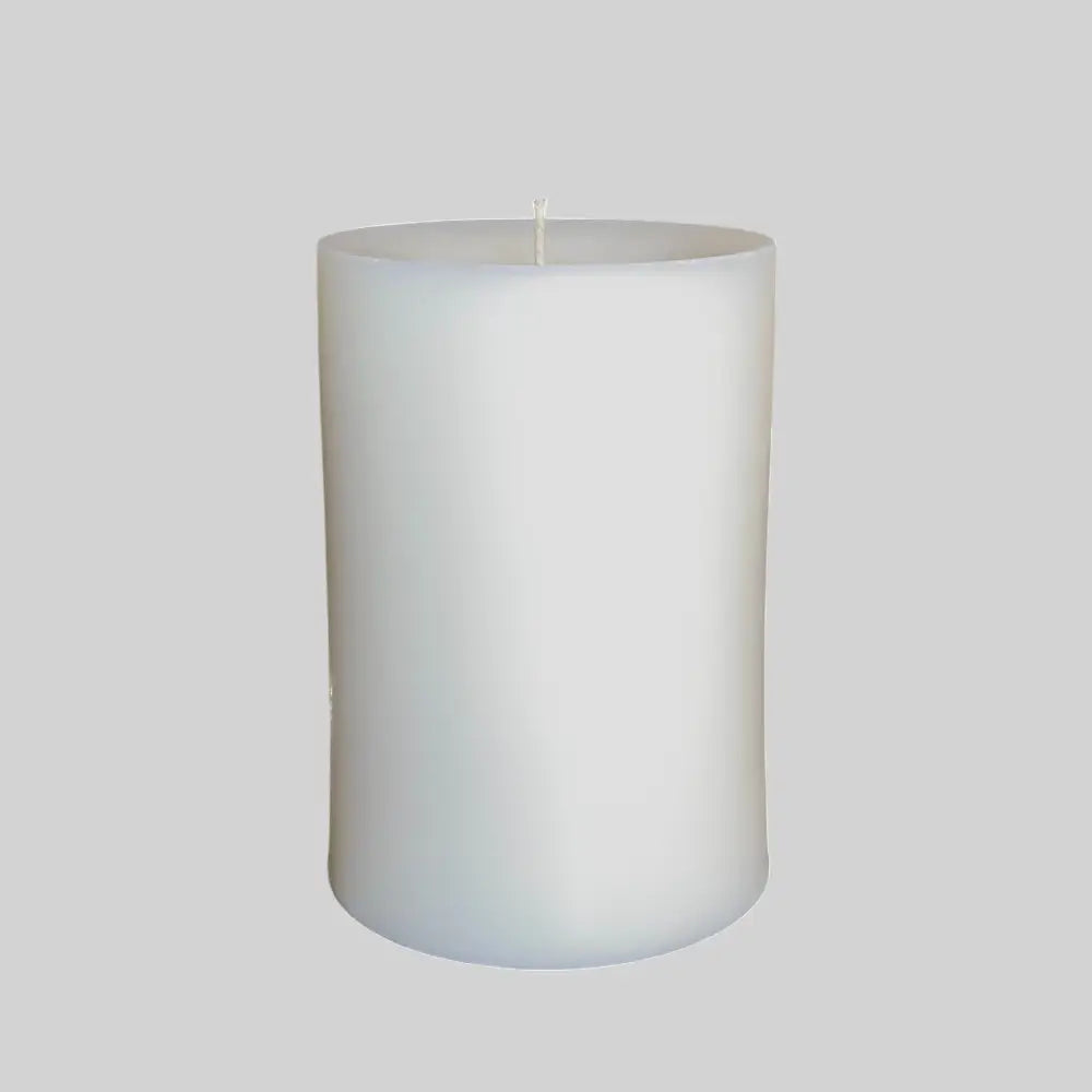 round white candle on grey background