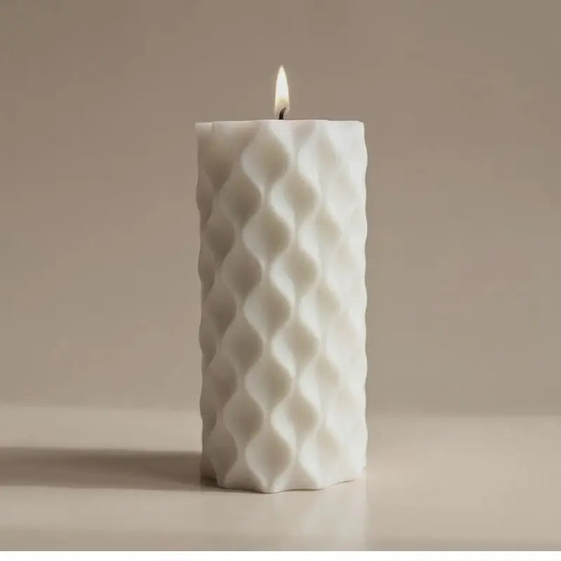 Beautiful White Pillar Candles with a textured design and a soft flame, perfect for enhancing any relaxing space.