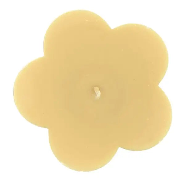 Flower-shaped candle on a white background