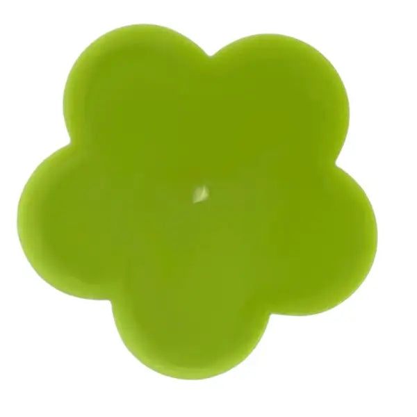 Green flower-shaped candle on a white background