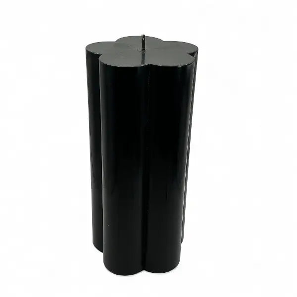 Black flower shaped candle on a white background