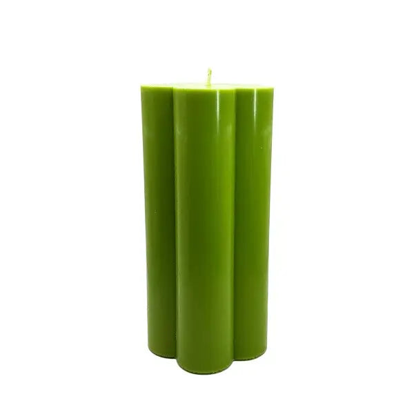 Green candle on a white background