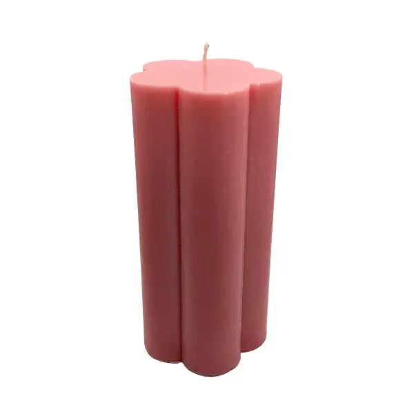 Pink candle on a white background