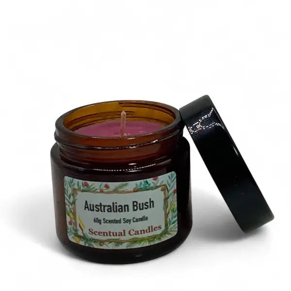 Scentual Candles Australian Bush candle in a amber jar with a black lid on a white background
