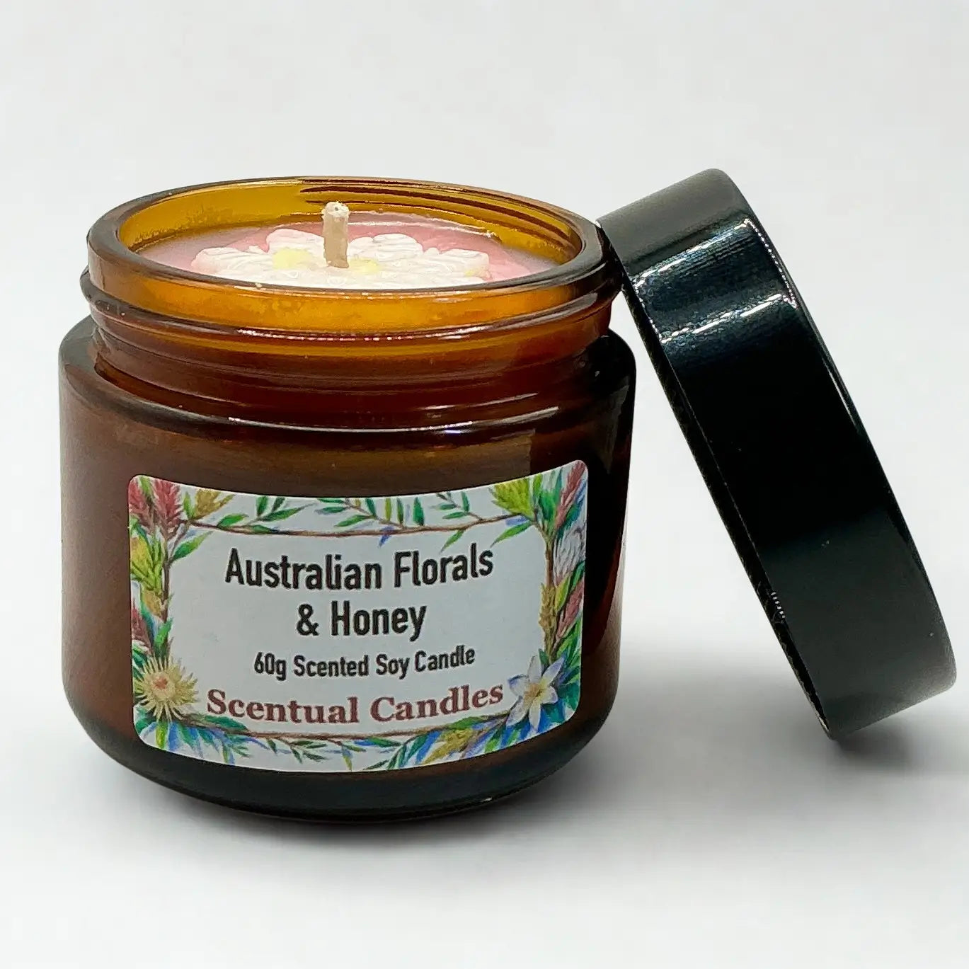 Scentual candles jar labeled 'Australian Florals & Honey' on a white background