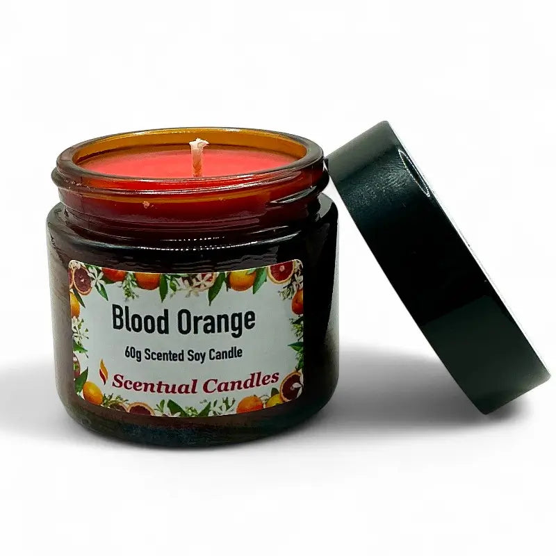 Scentual Candles Blood Orange candle in a jar with a label on a white background
