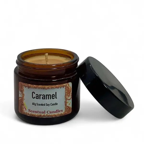 Scented candle in a jar labeled 'Caramel' with a black lid on a white background