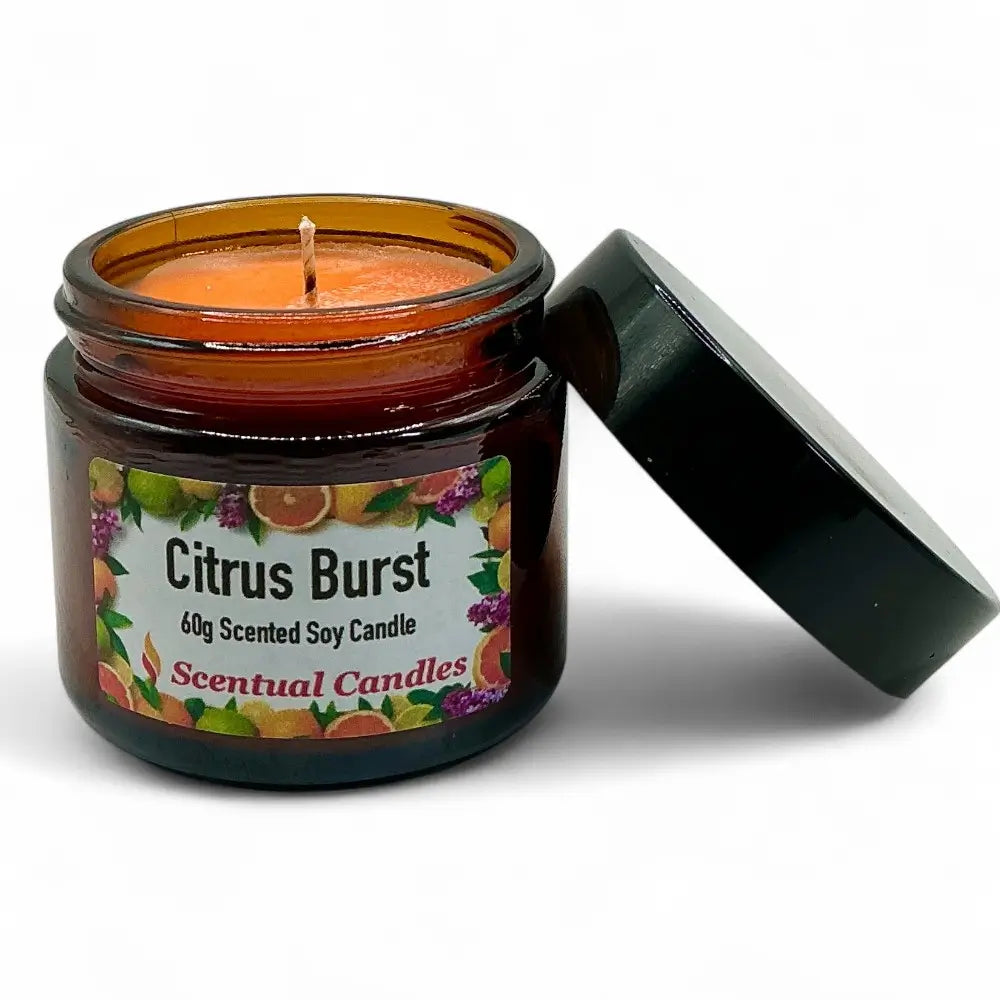 Scentual Candles Citrus Burst candle in a glass jar with a black lid on a white background