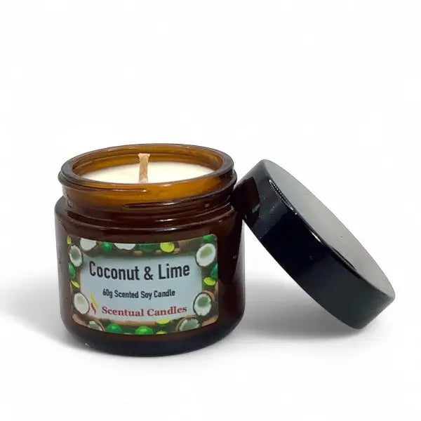 Coconut & Lime scented candle in an amber jar with a black lid on a white background