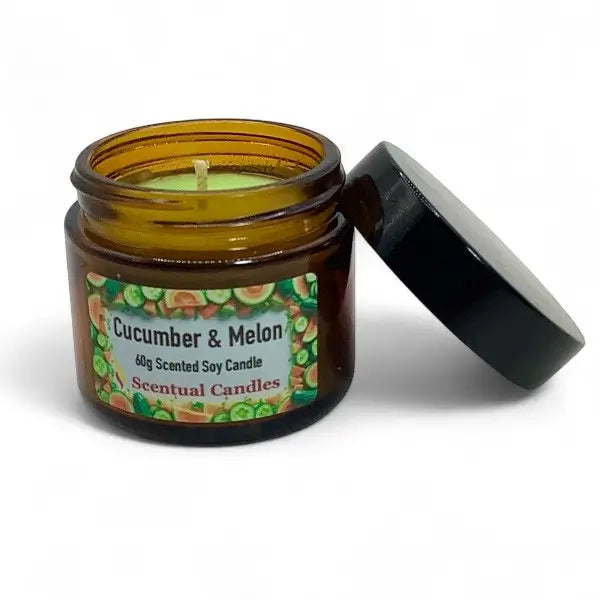 Cucumber & Melon scented candle in an amber jar with a black lid on a white background