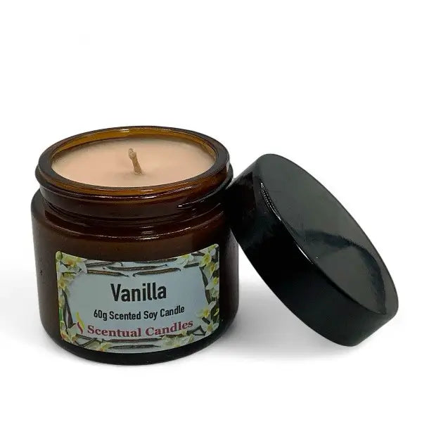 Vanilla scented soy candle in a brown jar with a black lid on a white background