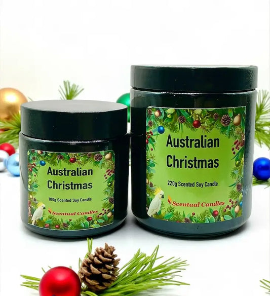 Australian Christmas scented soy candles in festive jars with greenery and ornaments.