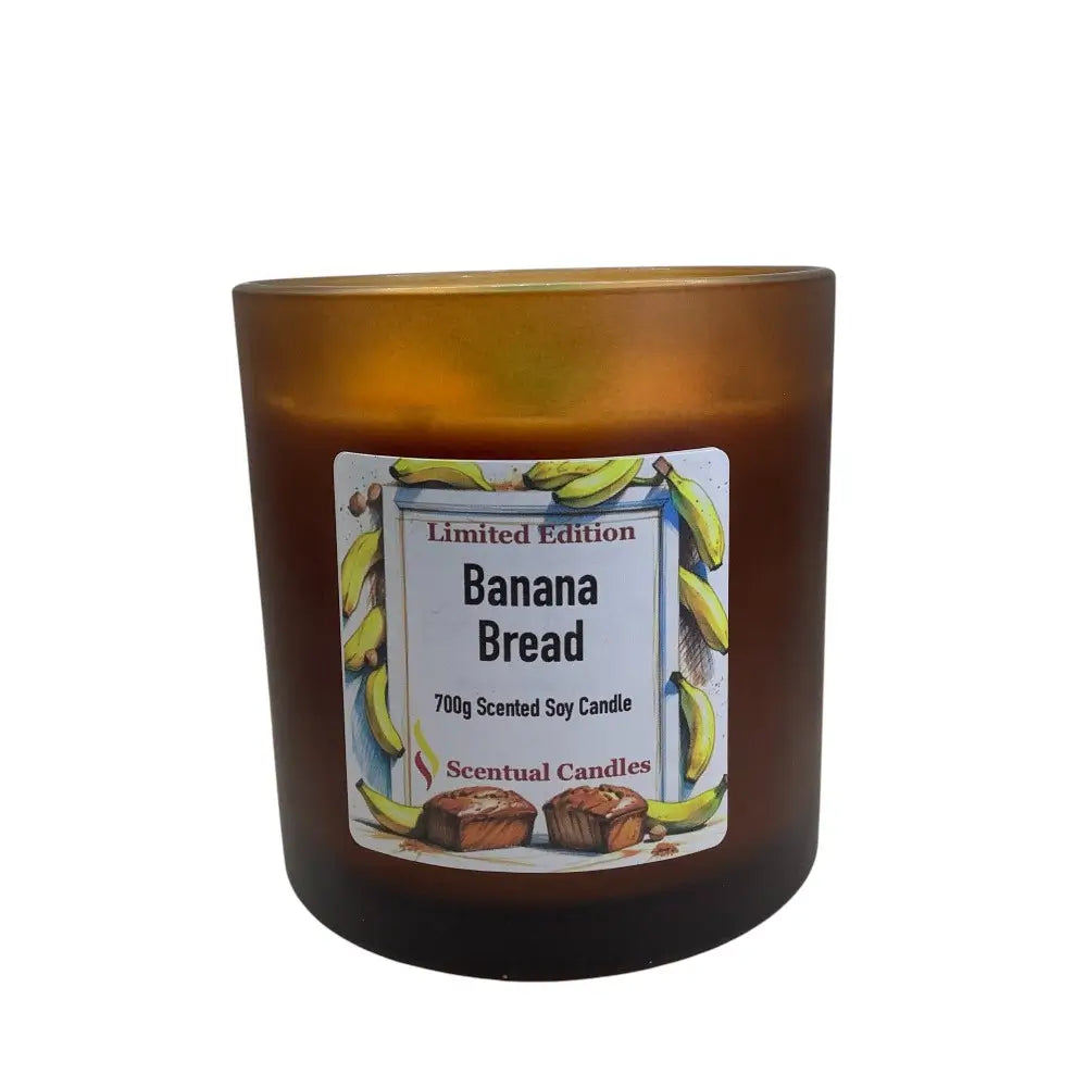 Brown candle with a label for 'Banana Bread' scent on a white background