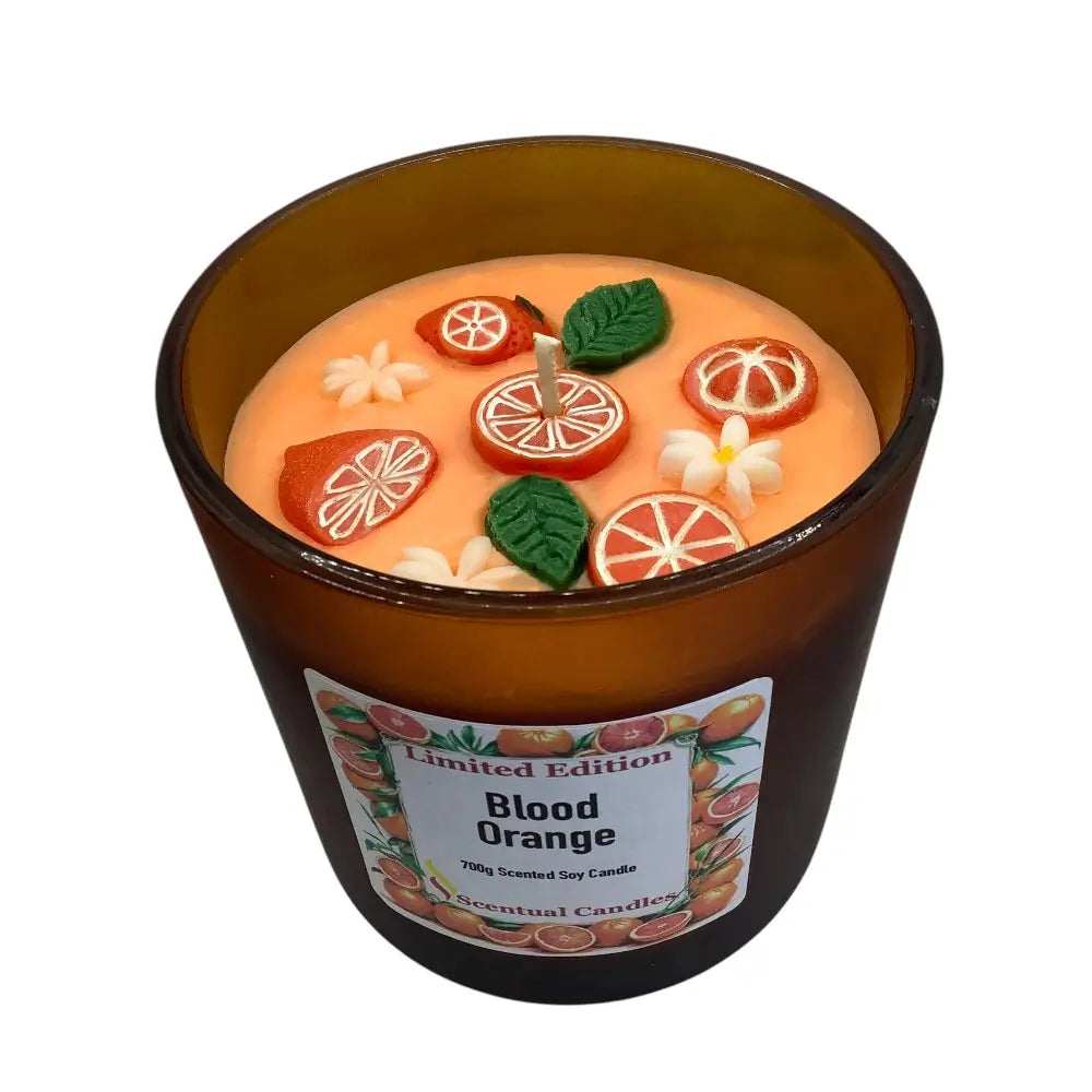 Blood Orange candle with decorative elements on a white background