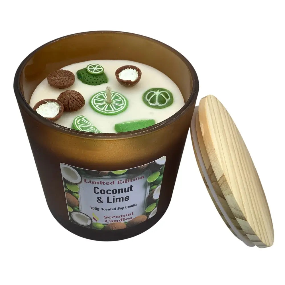 Scented candle with coconut and lime design in a brown container on a white background