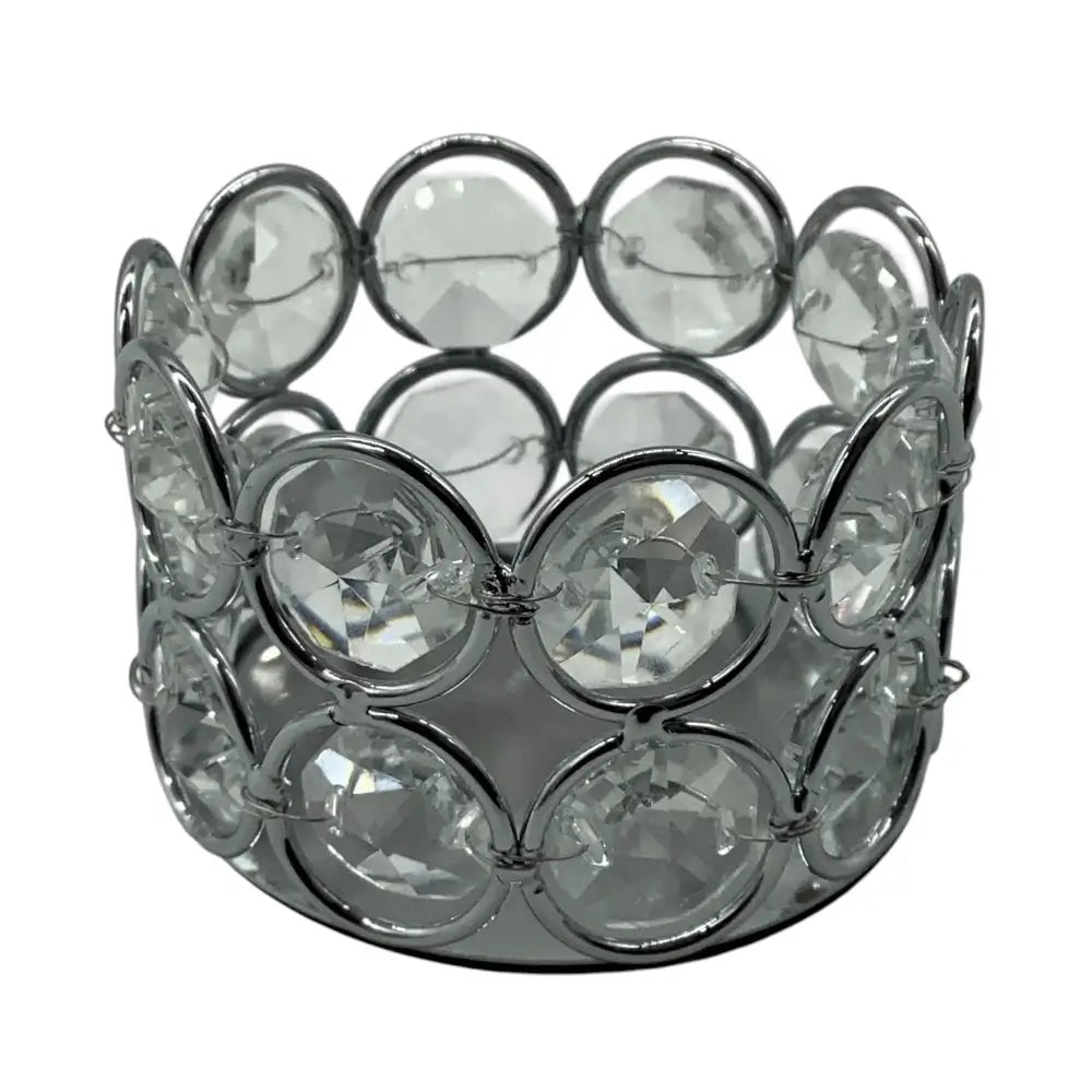 Decorative candle holder with crystal-like stones on a white background
