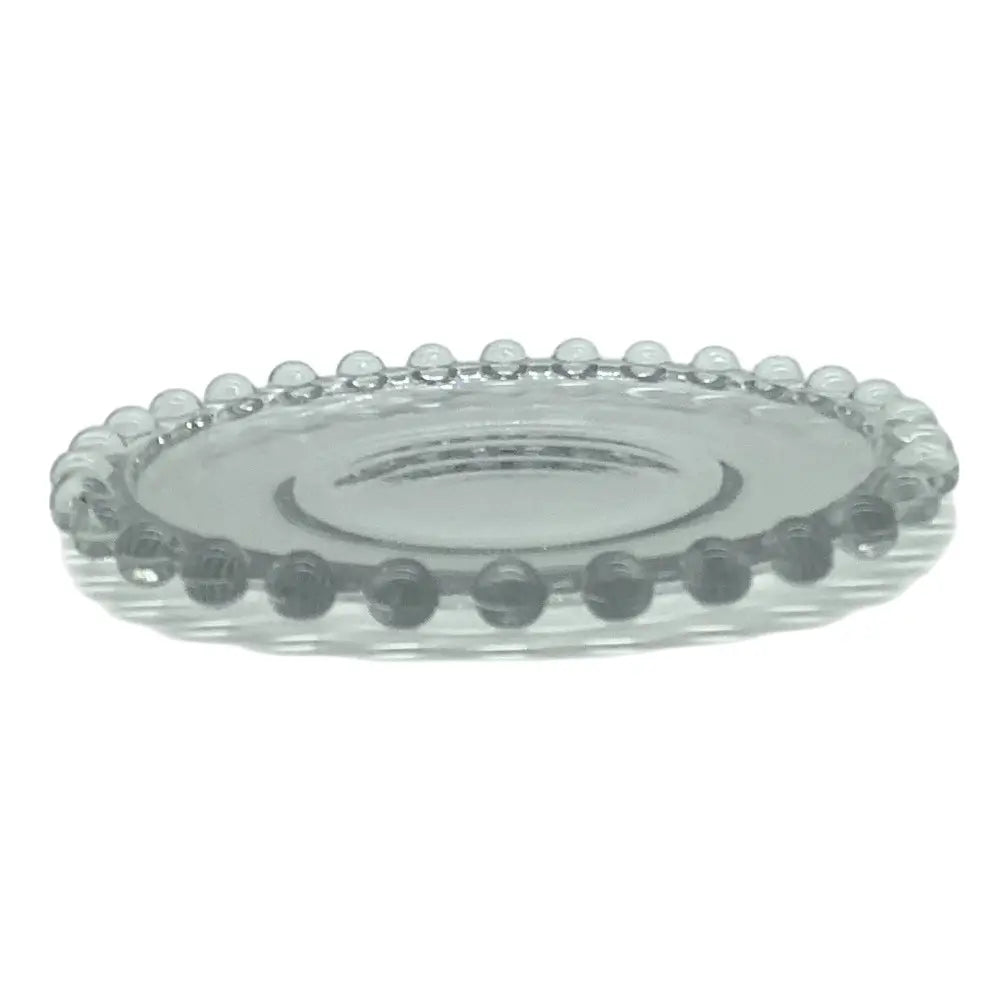 Clear glass plate with decorative edge on a white background