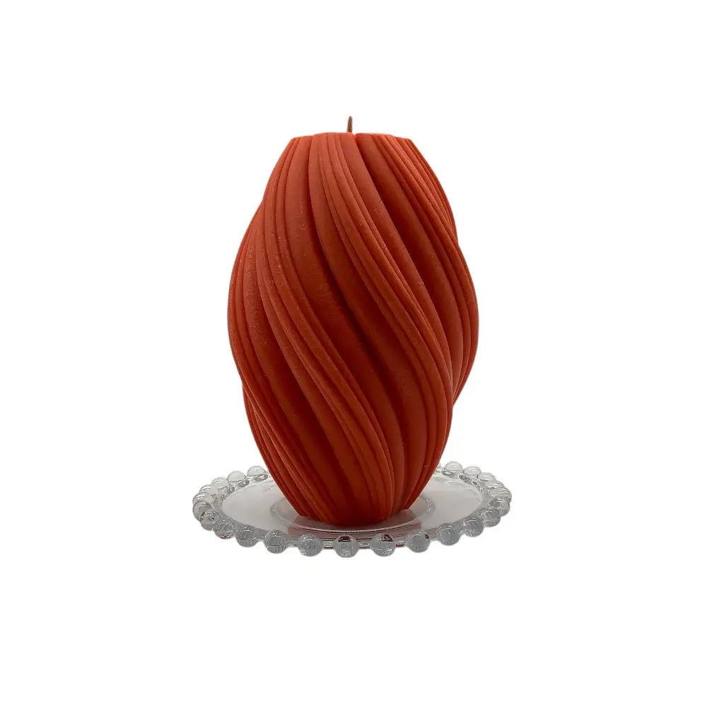 Blood Orange candle on a decorative glass candle plate with a white background