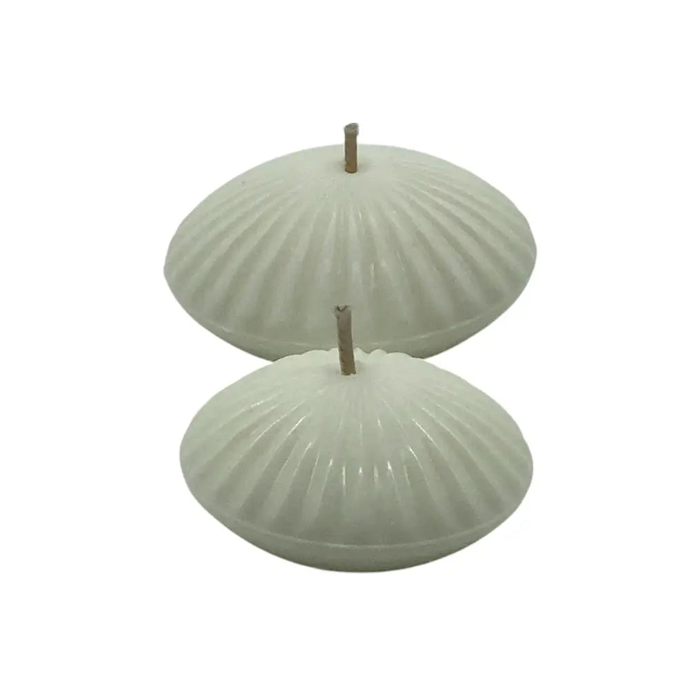two white floating candles side by side