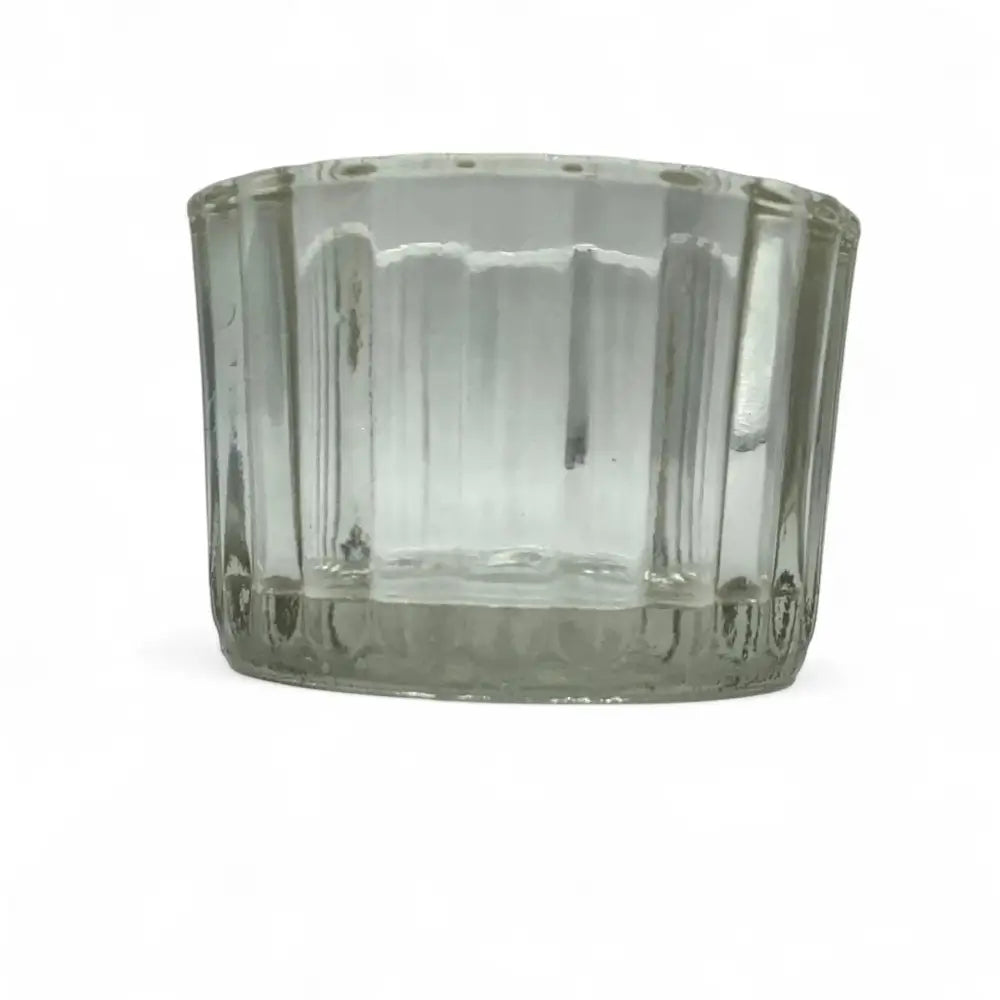 Clear glass candle holder on a white background