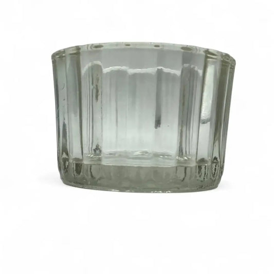 Clear glass candle holder on a white background