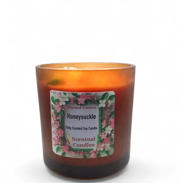 Scentual Candles Honeysuckle candle with floral label on a white background