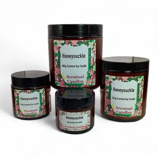 Set of Honeysuckle scented candles with floral labels on a white background