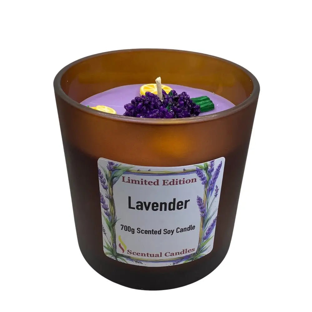 Lavender scented candle in a brown jar with a label on a white background