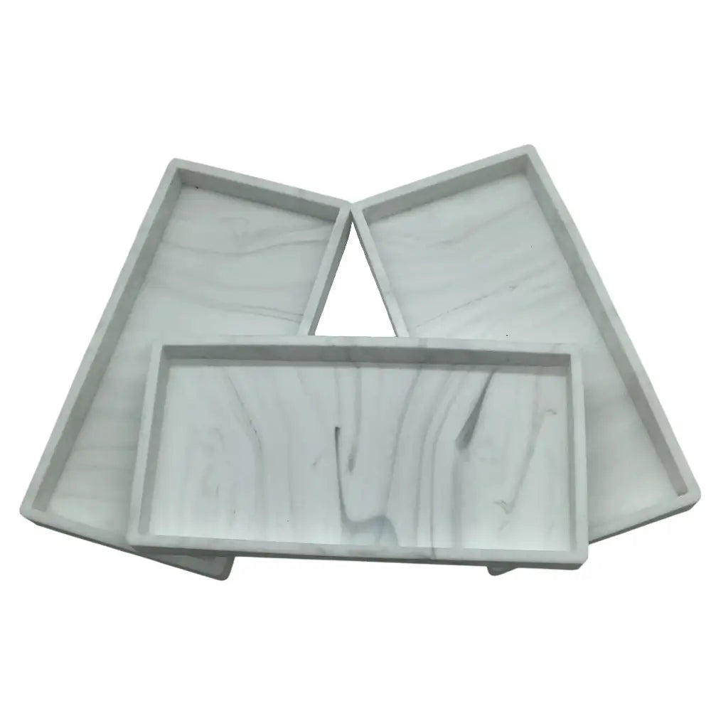 Three gray plastic trays on a white background
