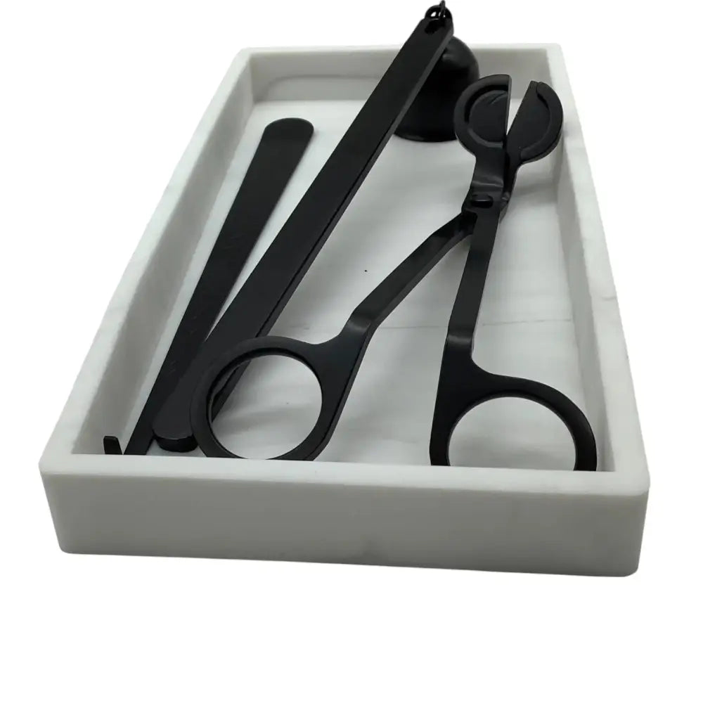 Set of black scissors and shears in a white box on a white background