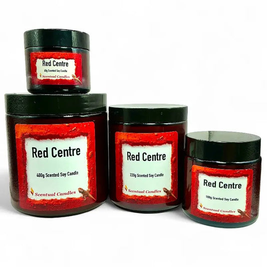 Set of four Spicy Vanilla Red Centre scented soy candles with red labels on a white background
