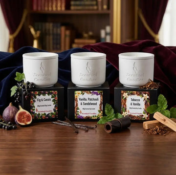 Tobacco and Vanilla Candle Set alongside Fig & Cassis and Vanilla, Patchouli & Sandalwood candles on a wooden table.