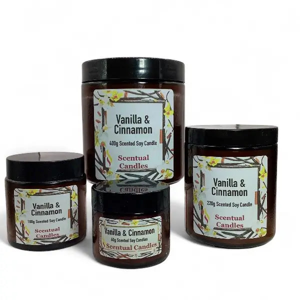 Four scented candles with 'Vanilla & Cinnamon' labels on a white background