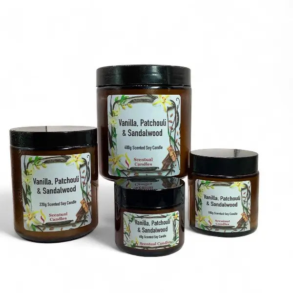 Set of four 'Vanilla, Patchouli & Sandalwood' scented candles with labels on a white background