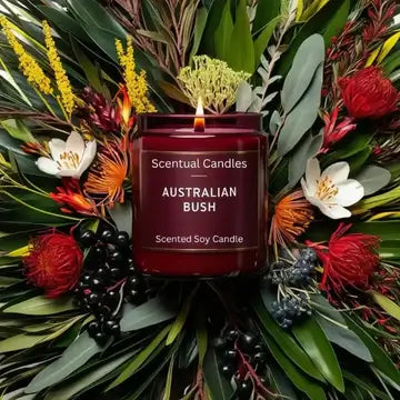 Scentual Candles Australian Bush candle surrounded by artificial flowers and leaves