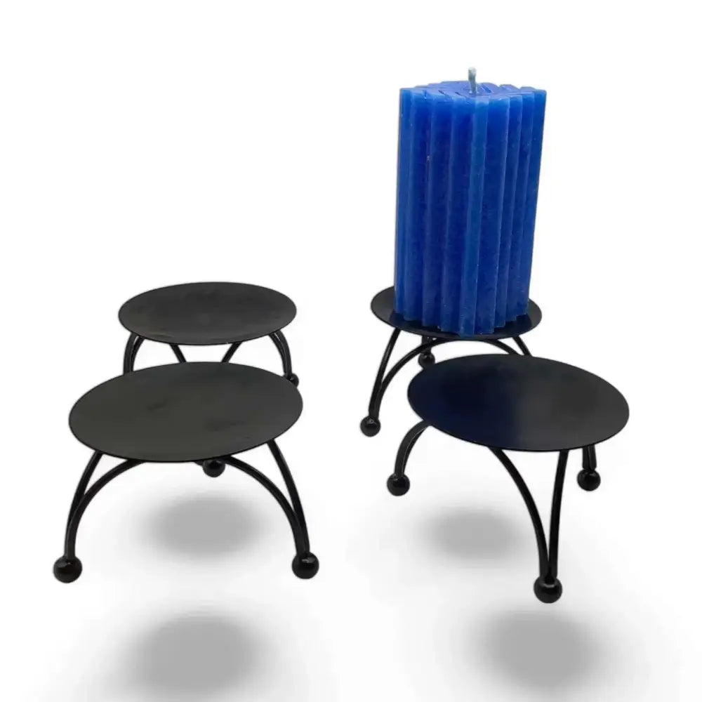 Round Black Metal Candle Stand with Nordic design and geometric three-legged base.